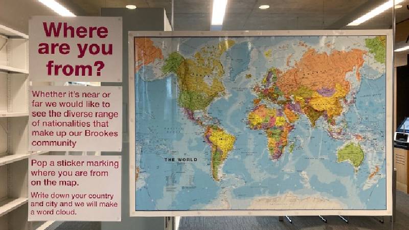world map with poster asking where are you from?